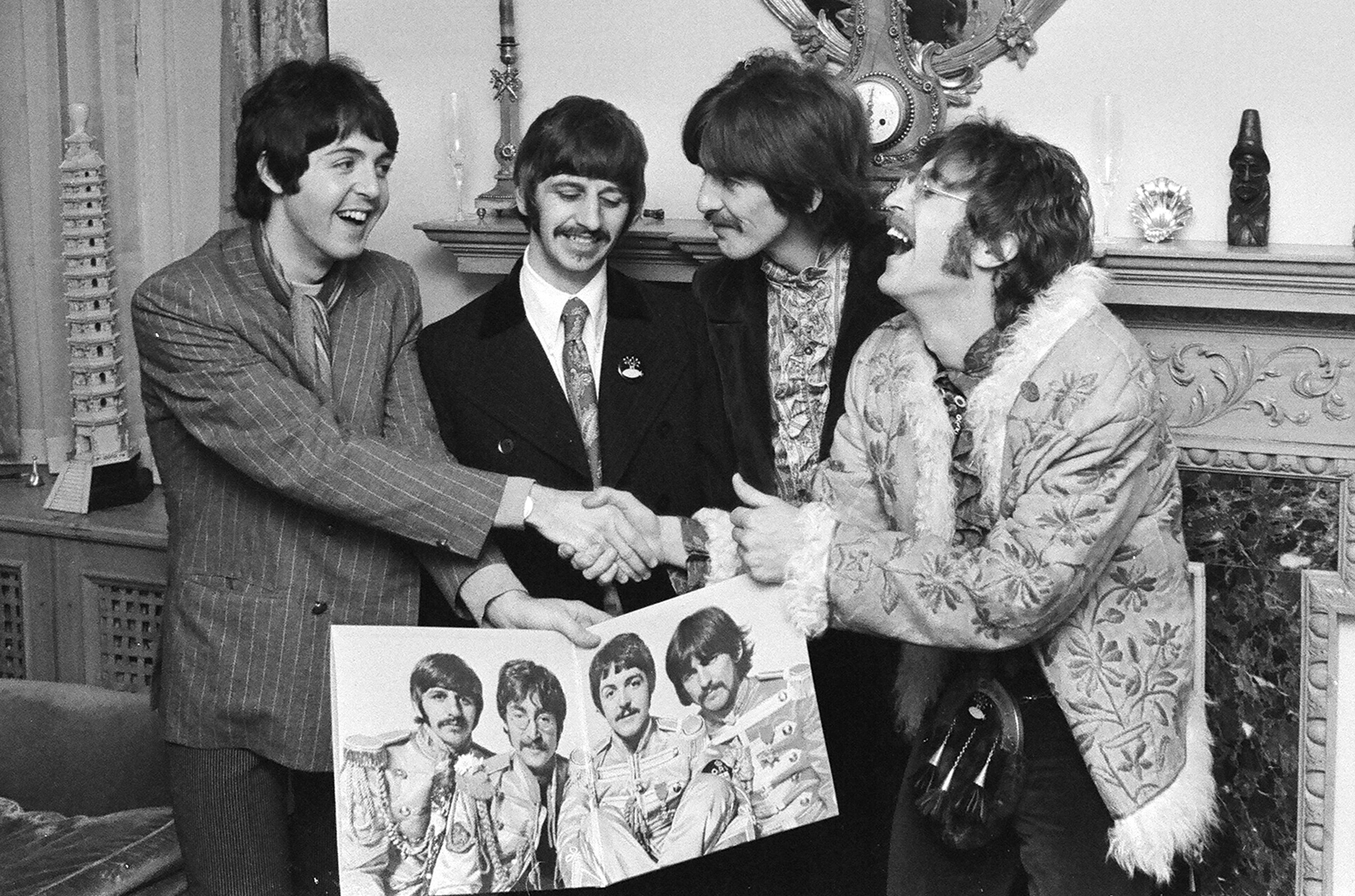 The Beatles with the finished album