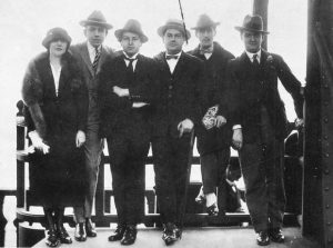 Les Six at the Eiffel Tower in 1921: left-to-right Germaine Tailleferre, Francis Poulenc, Arthur Honegger, Darius Milhaud, the artist Jean Cocteau, and Georges Auric (missing: Louis Durey)