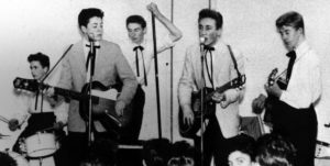 The Quarrymen performing on November 23, 1957; left-to-right Colin Hanton, Paul McCartney, Len Garry, John Lennon, Eric Griffiths