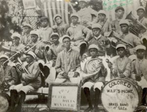 Armstrong (see arrow) circa 1913 in the Colored Waif's Home band