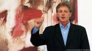 Paul McCartney standing in front of one of his paintings at the Kunstforum Lyz gallery in Siegen, July 1999