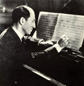 George Gershwin composing at the piano. American composer, 1898-1937.