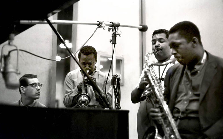 The Miles Davis Sextet recording Kind of Blue in 1959; left-to-right Bill Evans (1929-1980), Miles Davis (1926-1991), Cannonball Adderley (1928-1975), and John Coltrane (1926-1967); not in photo: bassist Paul Chambers, drummer Jimmy Cobb