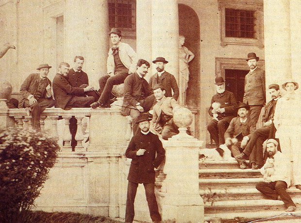 Debussy (fourth from left at top, wearing the top hat) on the steps of the Villa Medici in Rome among his “colleagues”; circa 1886