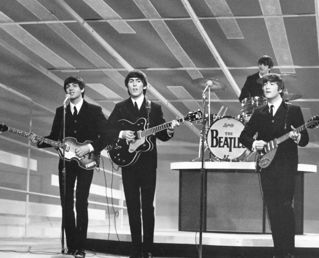 The Beatles performing during their first appearance on the Ed Sullivan Show, February 9, 1964