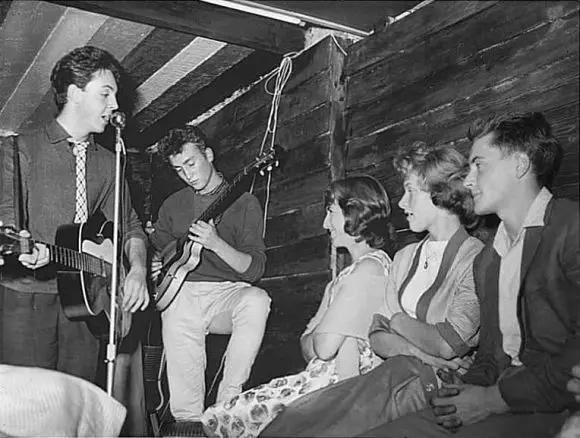 Paul McCartney (born 1942) and John Lennon (1940-1980) playing at the Casbah on August 29, 1959