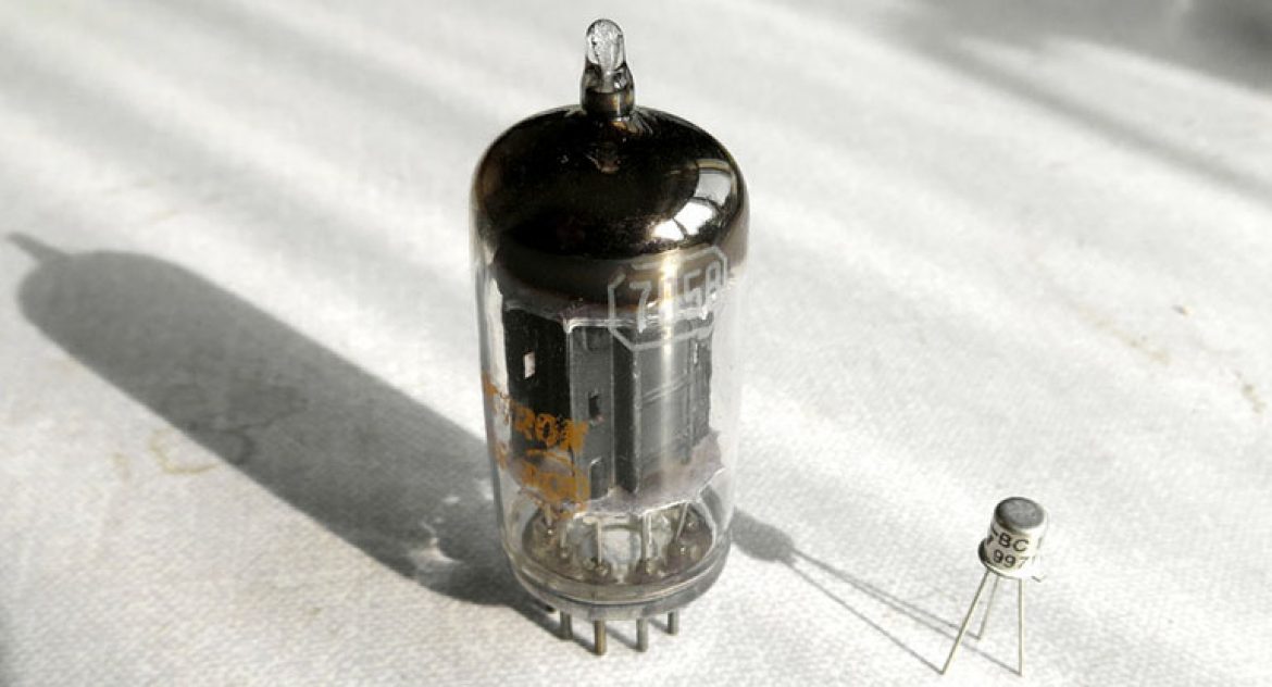 A side-by-side comparison: a relatively small vacuum tune on the left, and a transistor on the right